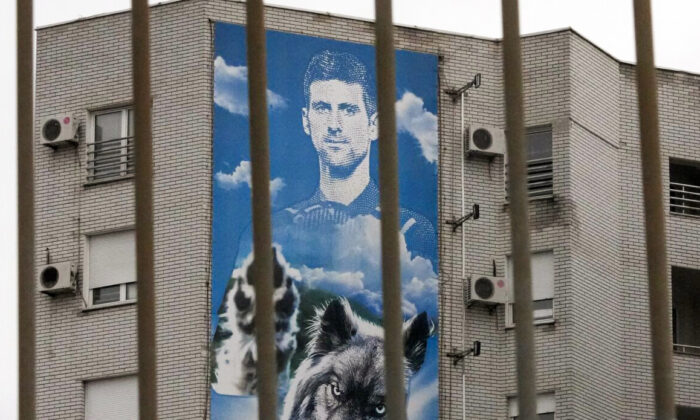 A billboard depicting Serbian tennis player Novak Djokovic hangs on a building in Belgrade, Serbia, on Jan. 6, 2022. (Darko Vojinovic/AP Photo)
