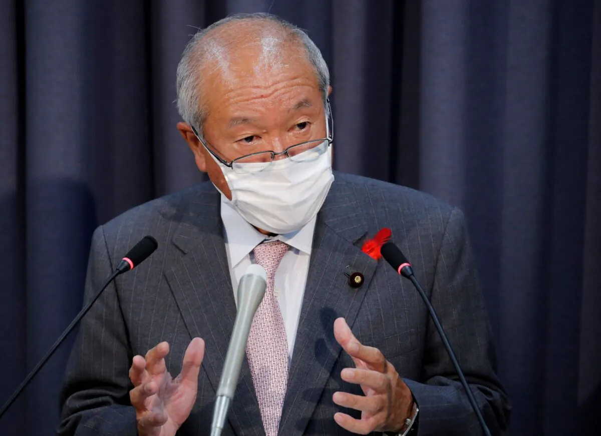 Japan's new Finance Minister Shunichi Suzuki wearing a protective mask, amid the coronavirus disease (COVID-19) outbreak, speaks at a news conference in Tokyo, Japan, on Oct. 5, 2021. (Kim Kyung-Hoon/Reuters)