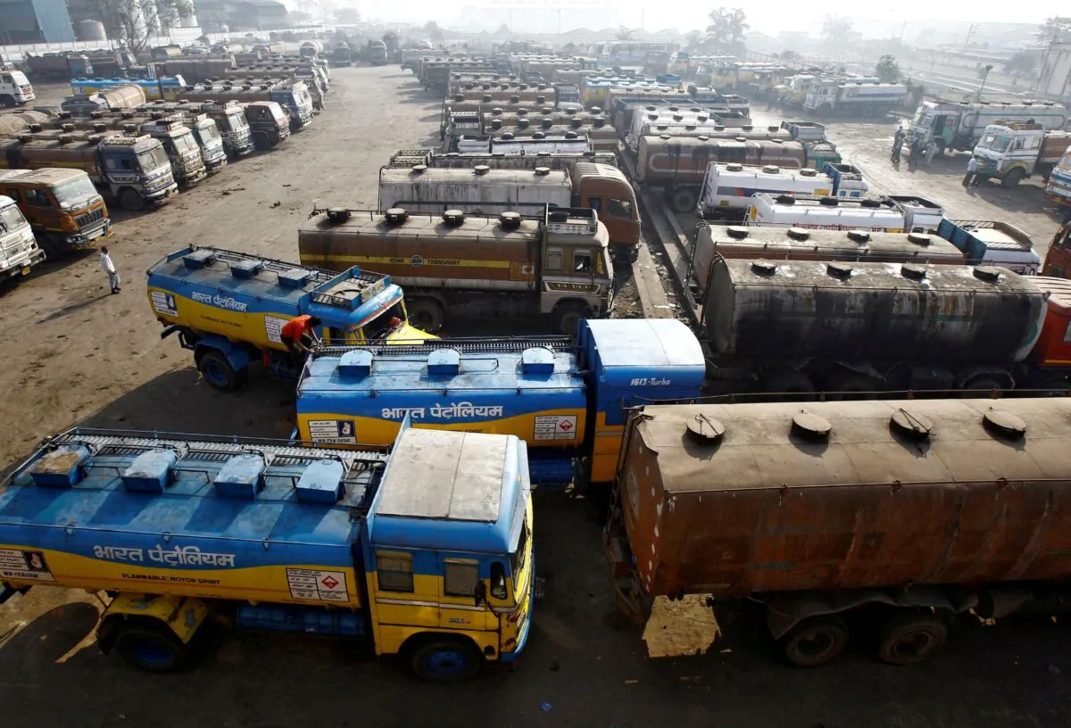Oil tankers are seen parked at a yard outside a fuel depot on the outskirts of Kolkata, on Feb. 3, 2015. (Rupak De Chowdhuri/Reuters)