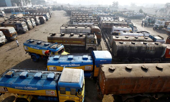 Oil tankers are seen parked at a yard outside a fuel depot on the outskirts of Kolkata, on Feb. 3, 2015. (Rupak De Chowdhuri/Reuters)