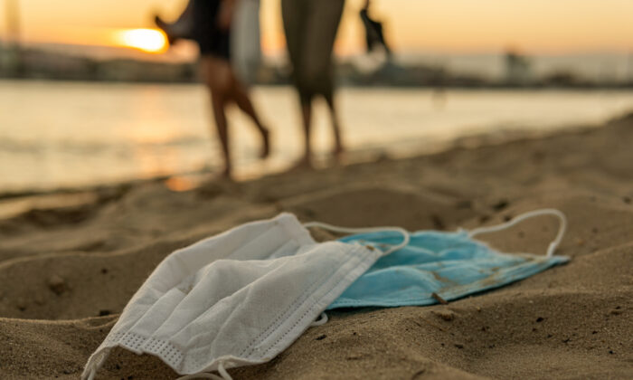 Discarded masks on a beach.
(Bezbod/Shutterstock)