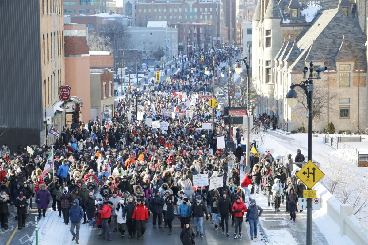 Several thousand protesters march against restrictive pandemic policies, in Montreal on Jan. 8, 2022. (Noé Chartier/The Epoch Times)