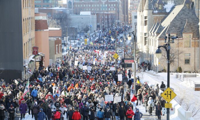 Several thousand protesters march against restrictive pandemic policies, in Montreal on Jan. 8, 2022. (Noé Chartier/The Epoch Times)