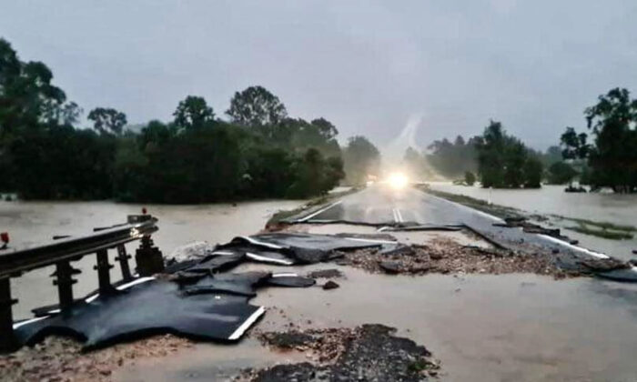 Part of the Bruce Highway washed away by floodwaters caused by ex-Cyclone Seth, north of Gympie, Australia, obtained on Jan. 8, 2022. (AAP Image/Supplied, Maleny State Emergency Service)