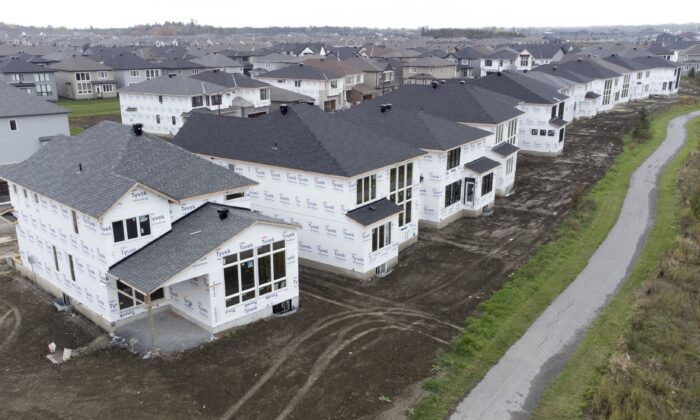 Homes under construction in a new suburb in Ottawa, on Oct. 15, 2021. (The Canadian Press/Adrian Wyld)