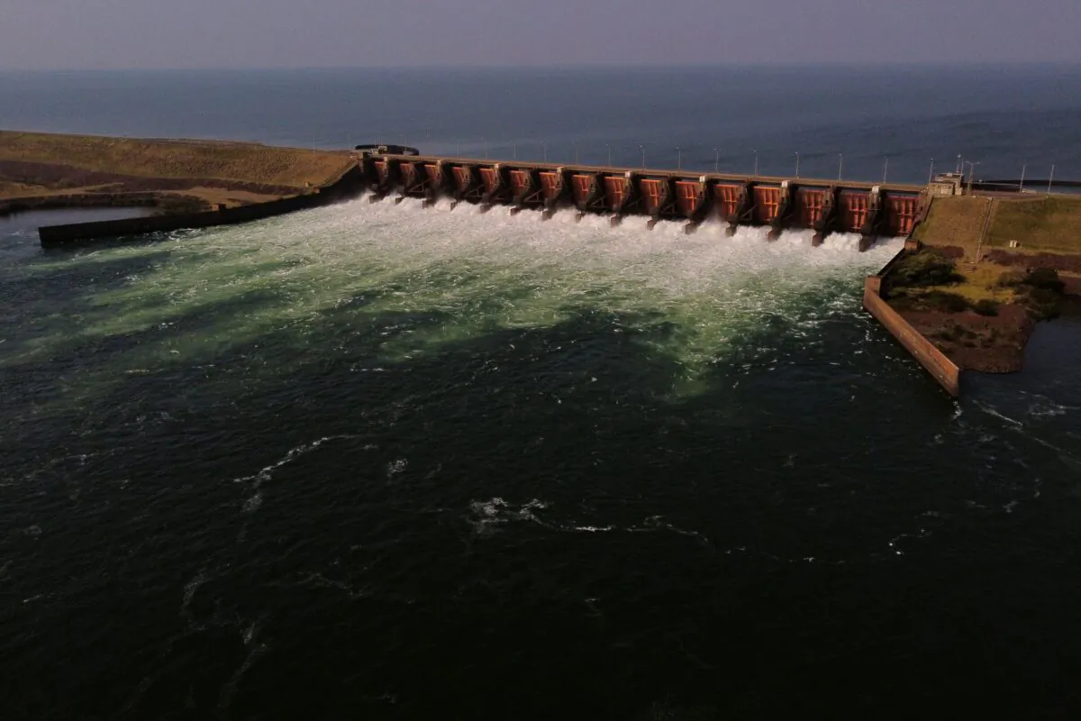 Aerial view of the water dumps of the Ana Cua arm of the Parana River, which water level reached a historic low, at the Yacyretá Dam in Yacyretá, Itapua, Paraguay, on Aug. 18, 2021. (JUAN MABROMATA/AFP via Getty Images)