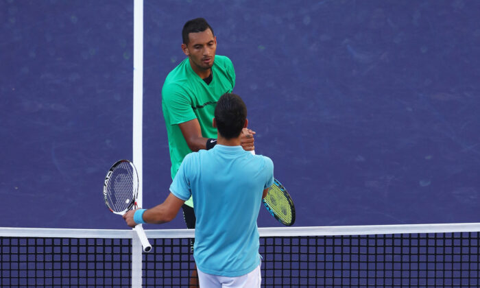 Nick Kyrgios of Australia shakes hands at the net after his straight set victory against Novak Djokovic of Serbia in their fourth round match during day ten of the BNP Paribas Open at Indian Wells Tennis Garden in Indian Wells, Calif., on March 15, 2017. (Clive Brunskill/Getty Images)