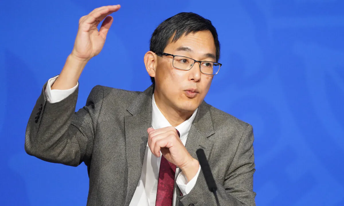 Professor Wei Shen Lim, COVID-19 immunisation chair of the Joint Committee on Vaccination and Immunisation, during a media briefing in Downing Street, London, on Nov. 29, 2021. (Stefan Rousseau/PA)