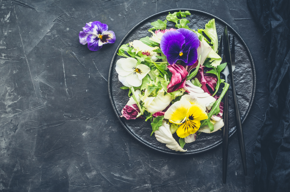 Think beyond lettuce—Evelyn's broad definition of a salad included room for edible flowers, foraged finds, and plants or plant parts we might overlook. (Nelli Syrotynska/Shutterstock)