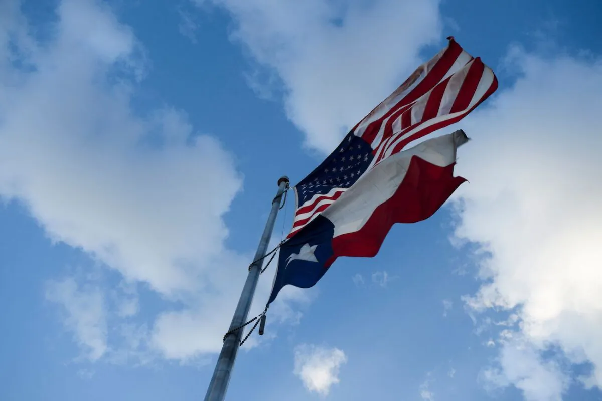 The U.S. Flag and the Texas State Flag are displayed at Murchison Rogers Park along Scenic Drive in El Paso, Texas, on June 24, 2021. (Patrick T. Fallon/AFP via Getty Images)