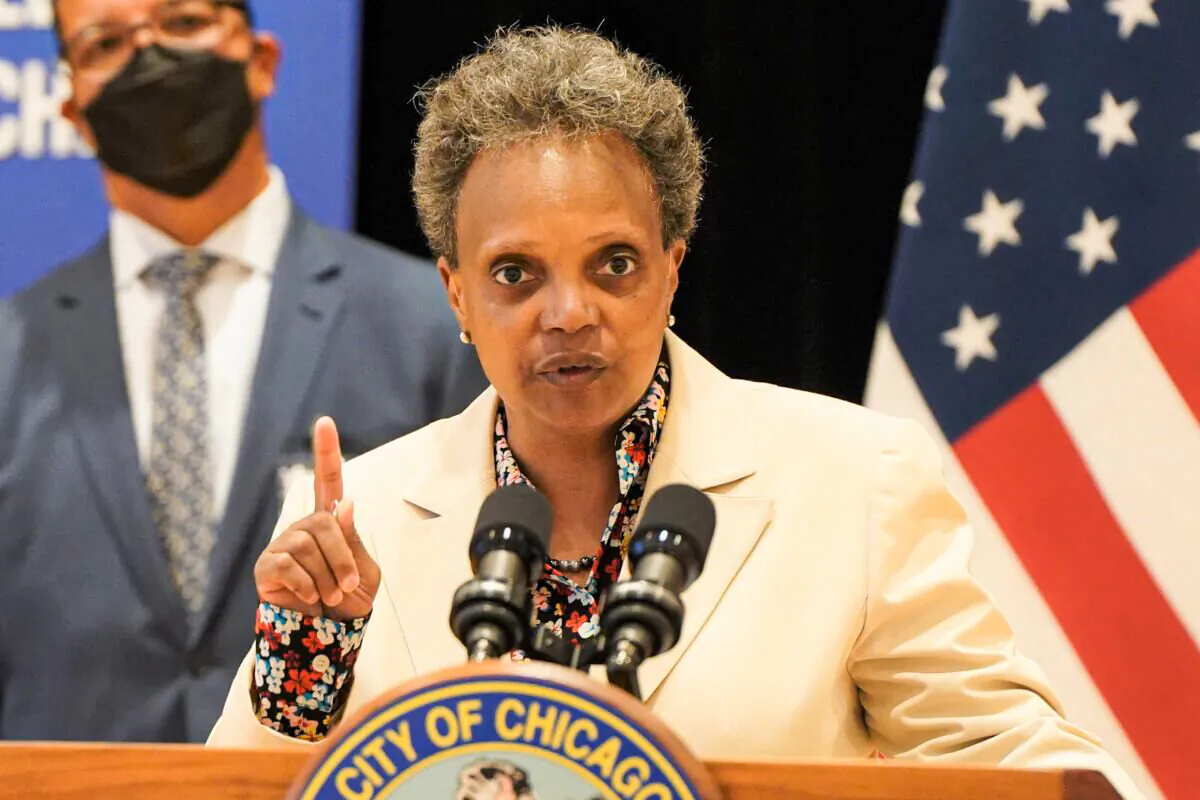 Chicago Mayor Lori Lightfoot, here speaking during a June 2021 press conference, is among big city mayors who support using federal pandemic assistance money to fund experimental guaranteed income programs, such as Chicago’s plan approved in April 2021 to provide 5,000 eligible recipients with $500 a month for one year beginning in August 2022. (Cara Ding/The Epoch Times)
