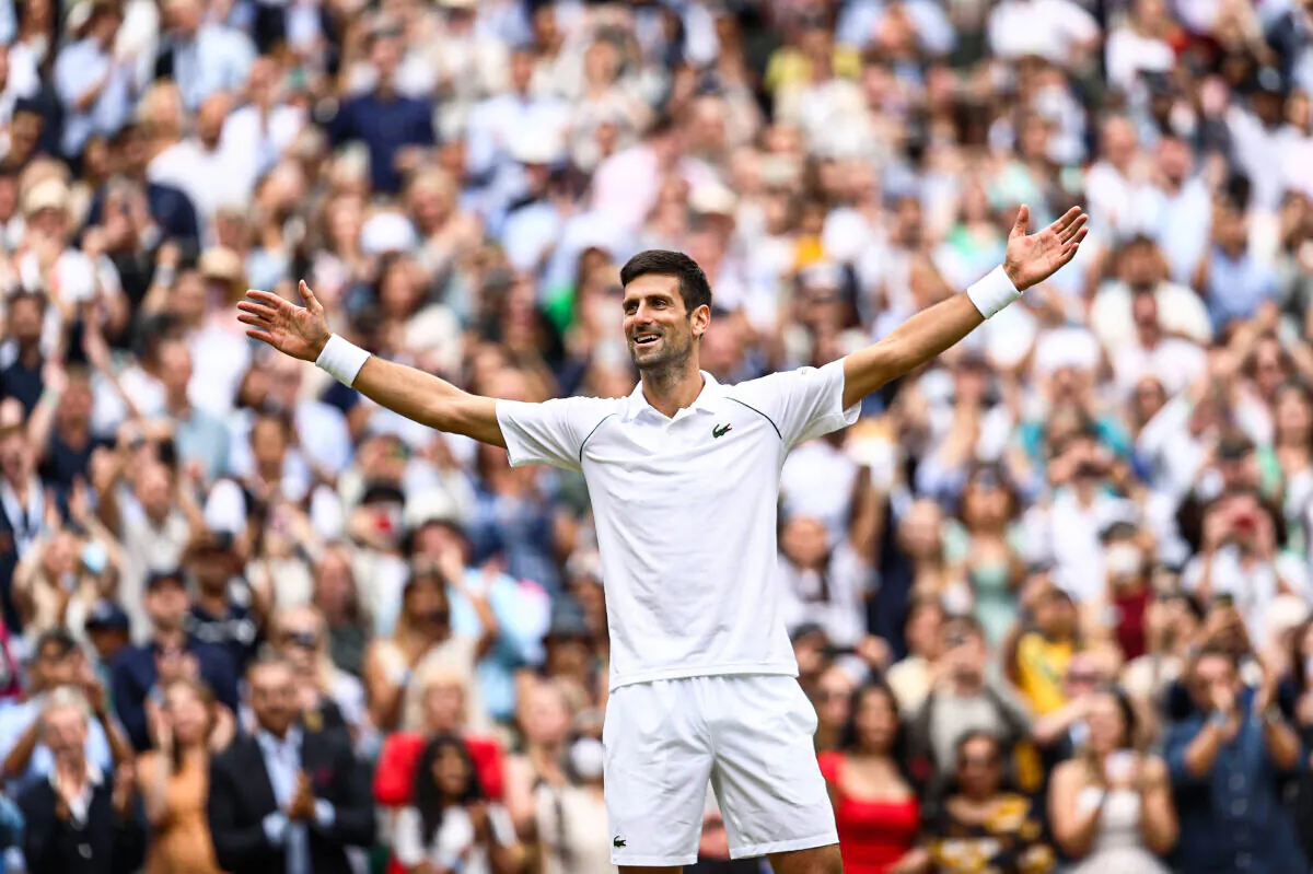 Novak Djokovic celebrates winning his men's Singles Final match against Matteo Berrettini of Italy on Day Thirteen of The Championships-Wimbledon 2021 at All England Lawn Tennis and Croquet Club in London on July 11, 2021. (Julian Finney/Getty Images)