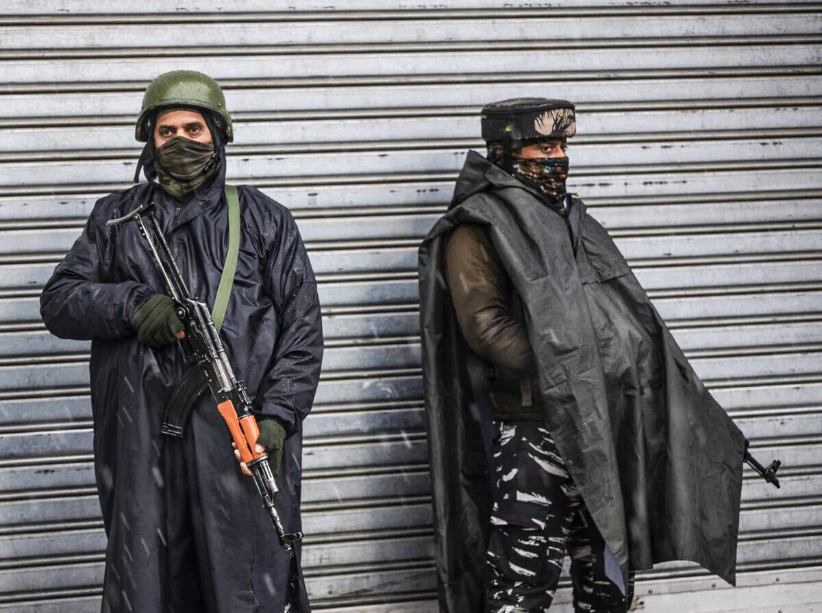 Indian paramilitary soldiers stand guard in Srinagar, Indian controlled Kashmir, on Jan. 8, 2022. (Mukhtar Khan/AP Photo)
