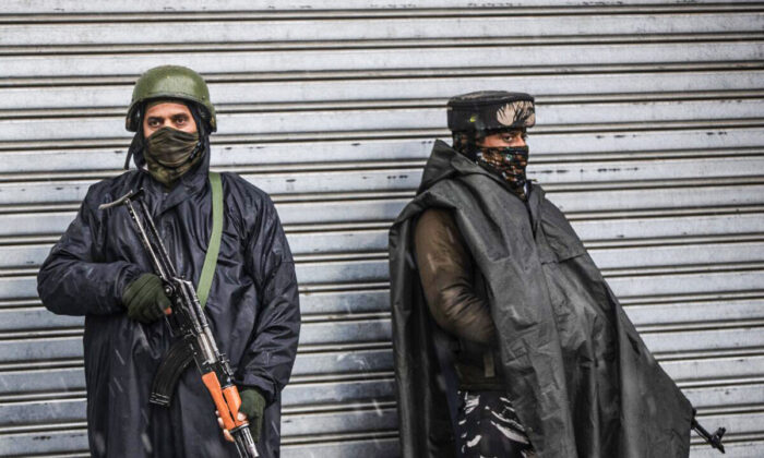 Indian paramilitary soldiers stand guard in Srinagar, Indian controlled Kashmir, on Jan. 8, 2022. (Mukhtar Khan/AP Photo)