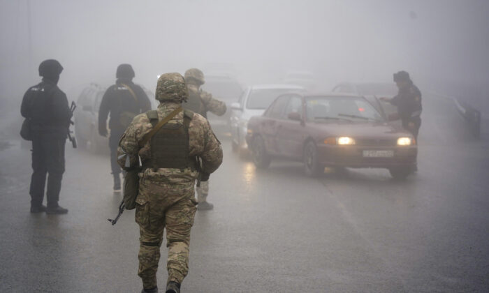 Kazakhstan's soldiers control the road in Almaty, Kazakhstan, on Jan. 8, 2022. (Vladimir Tretyakov/NUR.KZ via AP)