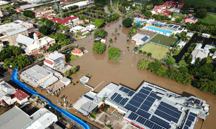 An aerial view of floodwaters impacting the CBD of Maryborough, north of Brisbane, Australia, in the wake of former tropical cyclone Seth. (AAP Image/Supplied by Jade Wellings)