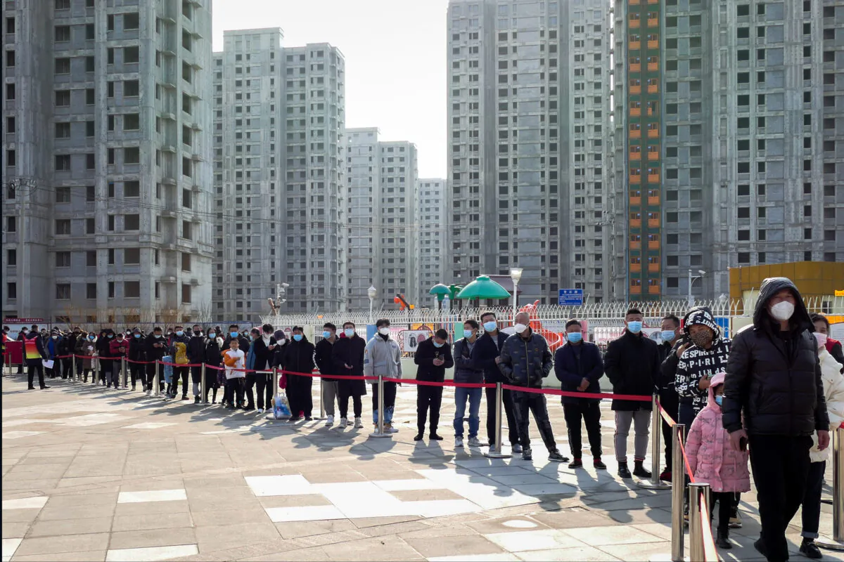 Residents line up for the coronavirus test during a citywide mass testing in Tianjin, China, on Jan. 9, 2022. (Chinatopix Via AP)