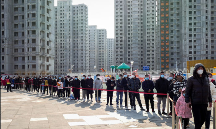 Residents line up for the coronavirus test during a citywide mass testing in Tianjin, China, on Jan. 9, 2022. (Chinatopix Via AP)