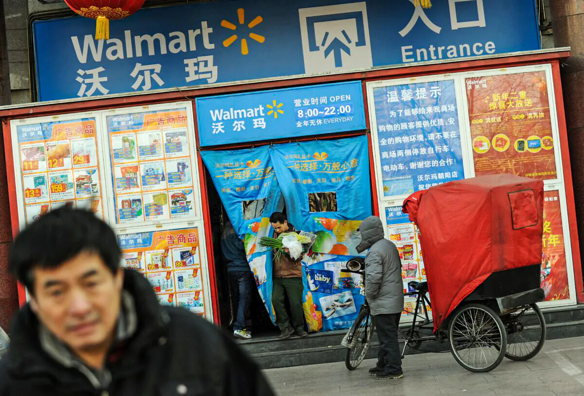 Chinese shoppers leave a Walmart store in Beijing on Jan. 3, 2012. Chinese President Hu Jintao has warned that "hostile" powers are seeking to "Westernize" the country and called for greater efforts to enhance China's cultural influence overseas. (Mark Ralston/AFP via Getty Images)