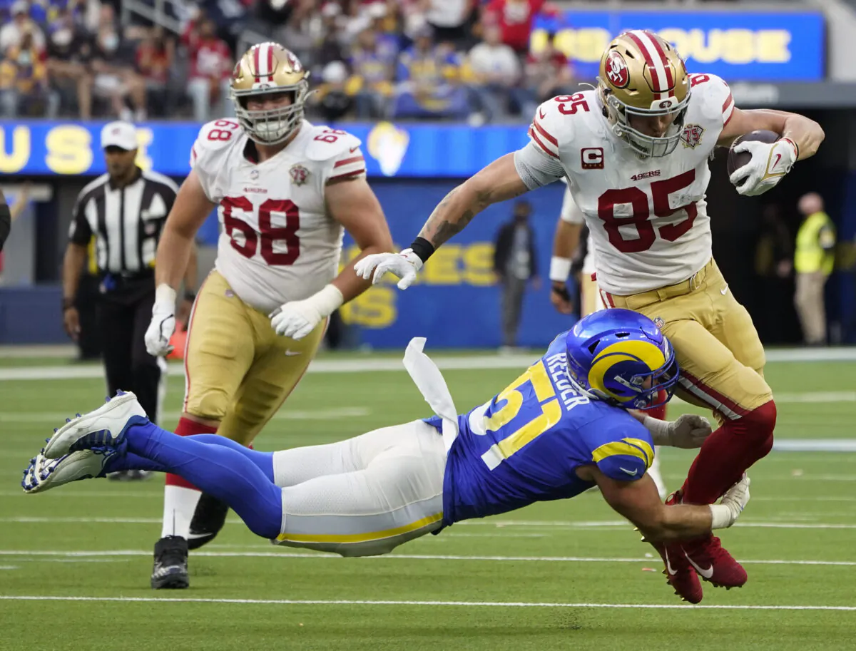 Los Angeles Rams inside linebacker Troy Reeder (51) tackles San Francisco 49ers tight end George Kittle (85) during the second half of an NFL football game in Inglewood, Calif., on Jan. 9, 2022. (AP Photo/Marcio Jose Sanchez)