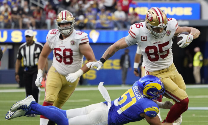 Los Angeles Rams inside linebacker Troy Reeder (51) tackles San Francisco 49ers tight end George Kittle (85) during the second half of an NFL football game in Inglewood, Calif., on Jan. 9, 2022. (AP Photo/Marcio Jose Sanchez)