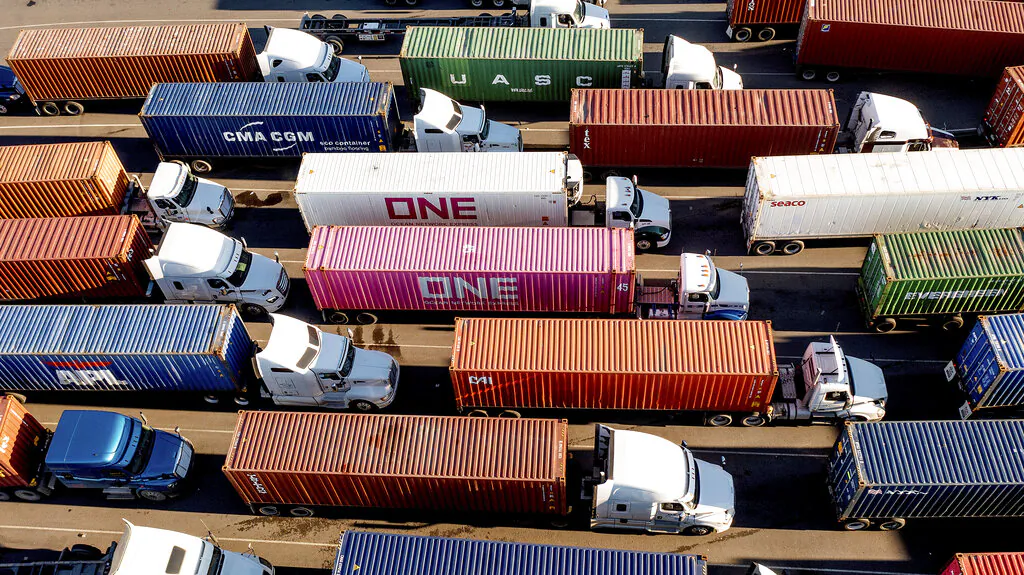 Trucks line up to enter a Port of Oakland shipping terminal in Oakland, Calif., on Nov. 10, 2021. (Noah Berger/AP Photo)