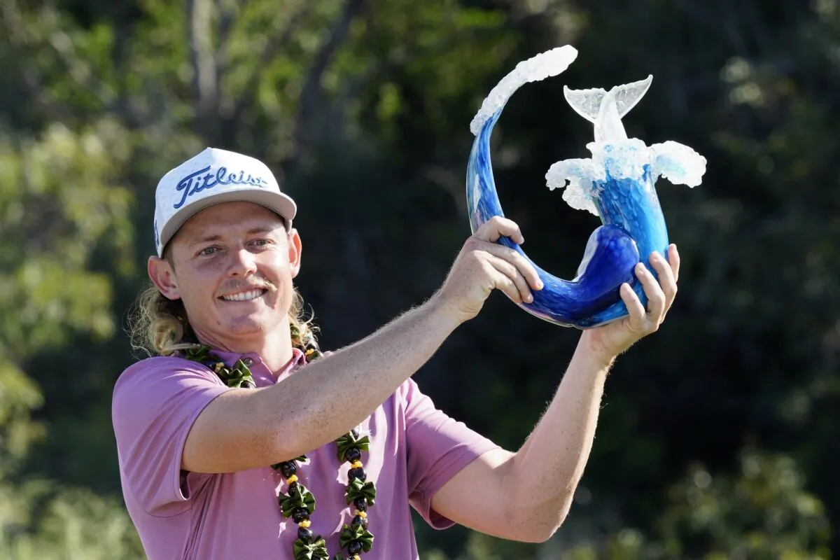 Cameron Smith holds the champions trophy at Kapalua Plantation Course in Kapalua, Hawaii on Jan. 9, 2022. (Matt York/AP Photo)