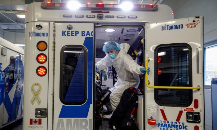 Paramedics and healthcare workers transfer a patient in Toronto on April 28, 2021. (Cole Burston/AFP Via Getty Images)