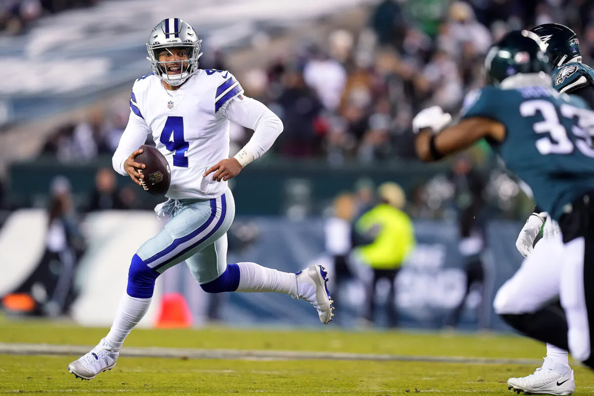 Dak Prescott #4 of the Dallas Cowboys runs with the ball in the first quarter of the game against the Philadelphia Eagles at Lincoln Financial Field in Philadelphia on Jan. 8, 2022. (Mitchell Leff/Getty Images)