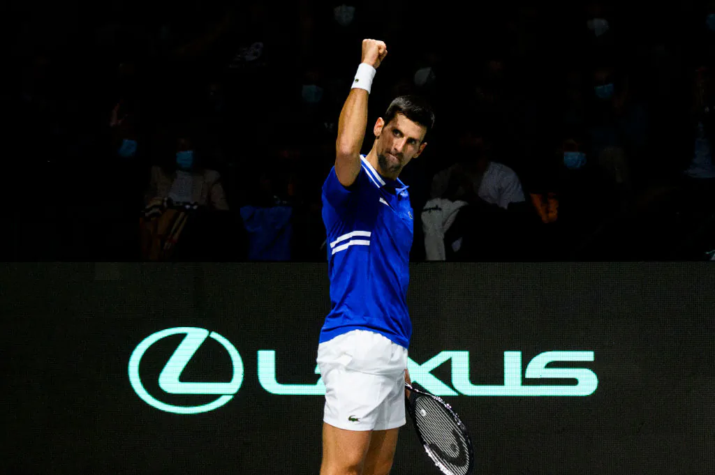 Novak Djokovic of Serbia plays a backhand against Marin Cilic of Croatia during the Davis Cup Semi Final match between Croatia and Serbia at Madrid Arena pavilion on December 03, 2021 in Madrid, Spain. (Juan Naharro Gimenez/Getty Images for Lexus)