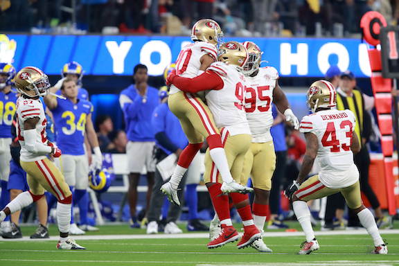 Ambry Thomas #20 of the San Francisco 49ers celebrates his game-ending interception in overtime against the Los Angeles Rams at SoFi Stadium, in Inglewood, Calif., on Jan. 9, 2022. (Joe Scarnici/Getty Images)