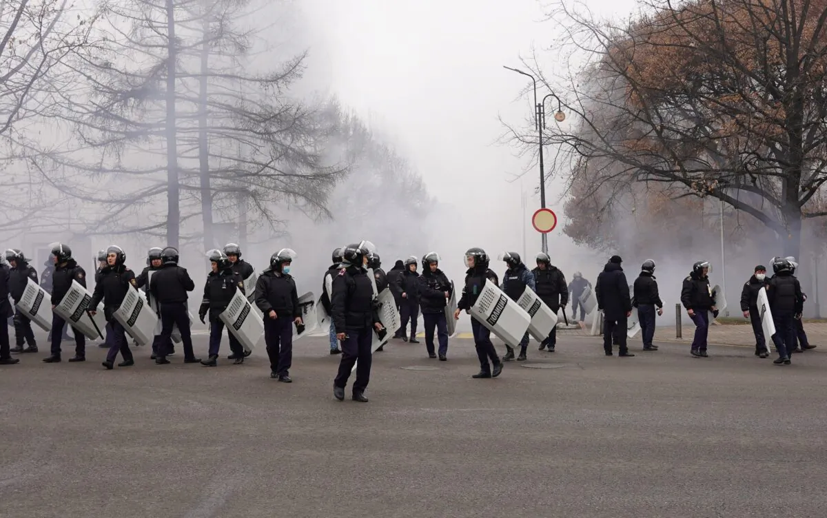 Riot police officers patrol in a street in Almaty, Kazakhstan, on Jan. 5, 2022. (Abduaziz Madyarov/AFP via Getty Images)