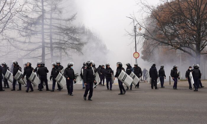 Riot police officers patrol in a street in Almaty, Kazakhstan, on Jan. 5, 2022. (Abduaziz Madyarov/AFP via Getty Images)