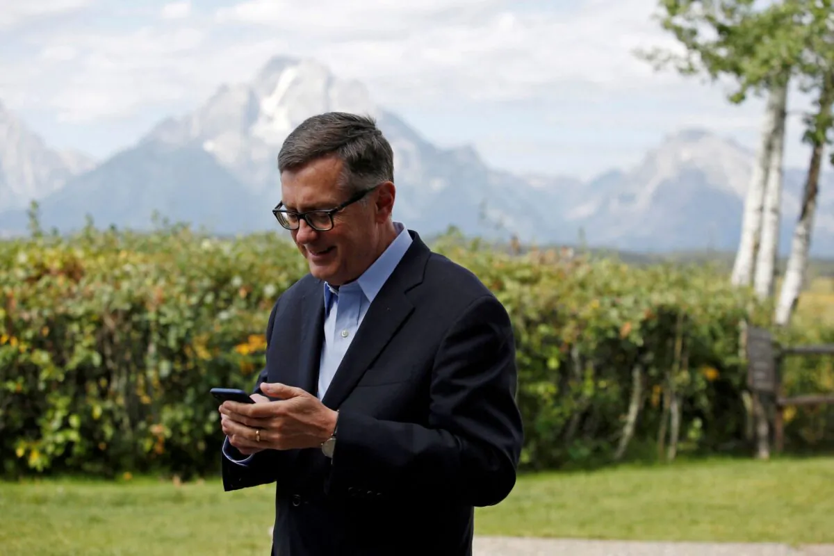 Federal Reserve Vice Chair Richard Clarida reacts as he holds his phone during the three-day "Challenges for Monetary Policy" conference in Jackson Hole, Wyo., on Aug. 23, 2019. (Jonathan Crosby/Reuters)