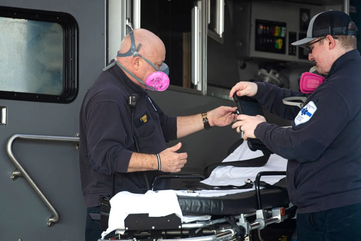 Paramedics prepare an ambulance at Hudson Regional Hospital in Secaucus, N.J., on Dec. 11, 2020. (Kena Betancur/AFP via Getty Images)