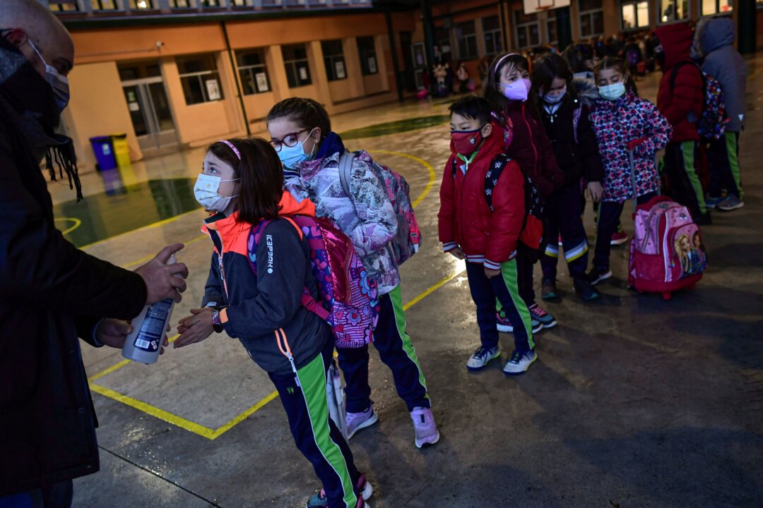 A group of young students wearing face masks in a file photo. (Alvaro Barrientos/AP Photo)