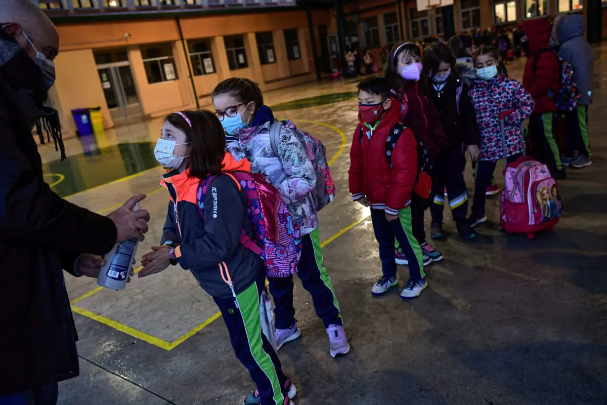 A group of young students wearing face masks in a file photo. (Alvaro Barrientos/AP Photo)