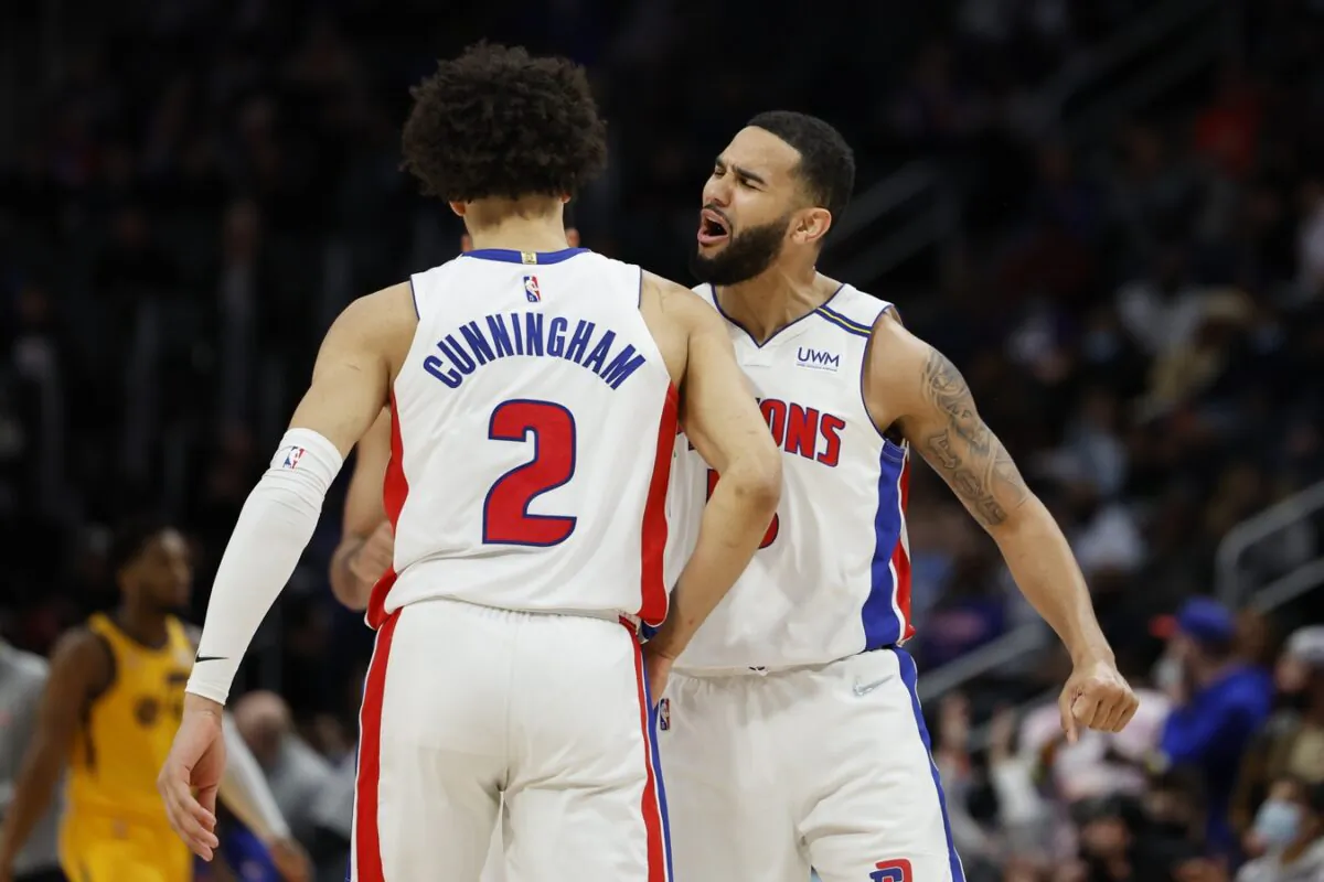 Detroit Pistons guard Cade Cunningham (2) receives congratulations from guard Cory Joseph (18) after he makes a three point basket in the second half against the Utah Jazz at Little Caesars Arena in Detroit, on Jan. 10, 2022. (Rick Osentoski/USA TODAY Sports via Field Level Media)