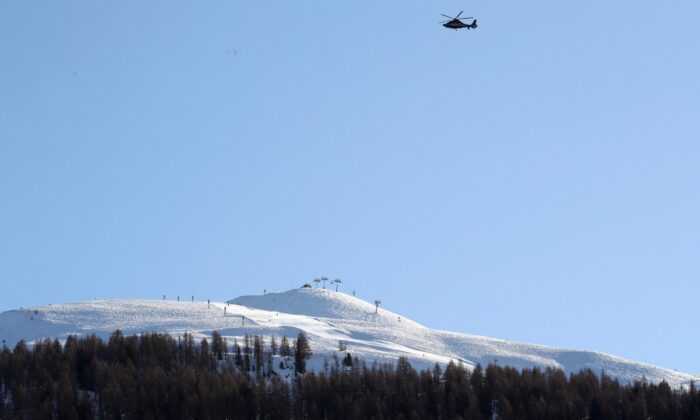 A helicopter flies over the ski resort during the 50th World Economic Forum (WEF) annual meeting in Davos, Switzerland, on Jan. 23, 2020. (Denis Balibouse/Reuters)