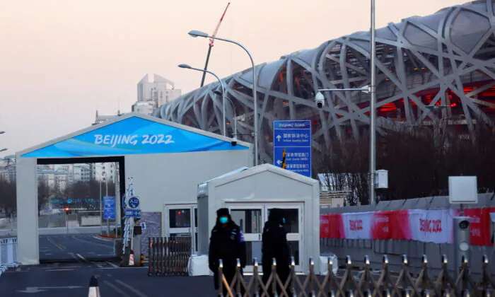 A car checkpoint in front of the National Stadium, also known as the Bird's Nest, where the opening and closing ceremonies of Beijing 2022 Winter Olympics will be held in Beijing, on Jan. 11, 2022. (Fabrizio Bensch/Reuters)