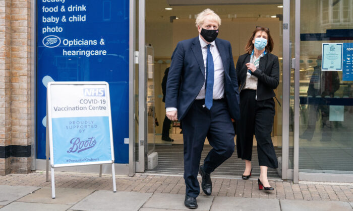 Prime Minister Boris Johnson leaves the Boots Pharmacy in Uxbridge, west London, on Jan. 10, 2022. (Dominic Lipinski/PA)