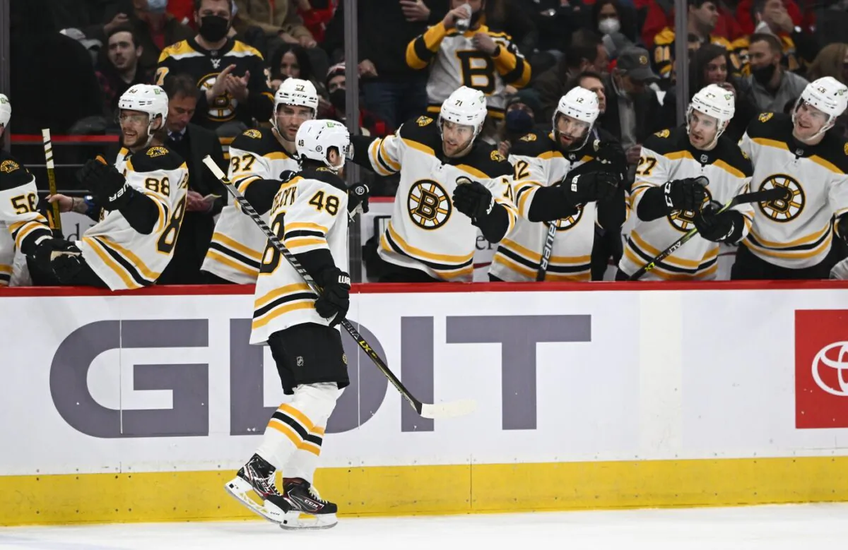 Boston Bruins defenseman Matt Grzelcyk (48) is congratulated by teammates, after scoring a goal against the Washington Capitals during an NHL game at Capital One Arena in Washington on Jan. 10, 2022. (Brad Mills/USA TODAY Sports via Field Level Media)