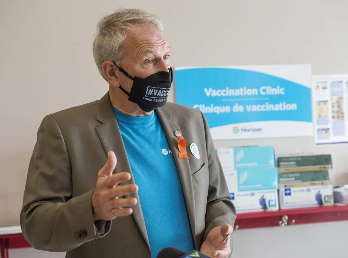 New Brunswick Premier Blaine Higgs speaks with the media after receiving his second dose of the Oxford-AstraZeneca COVID-19 vaccine in Fredericton, on June 4, 2021. (The Canadian Press/Stephen MacGillivray)