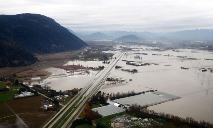 Flooded farms along the Trans-Canada Highway in Abbotsford, B.C., on Nov. 22, 2021. (The Canadian Press/Darryl Dyck)