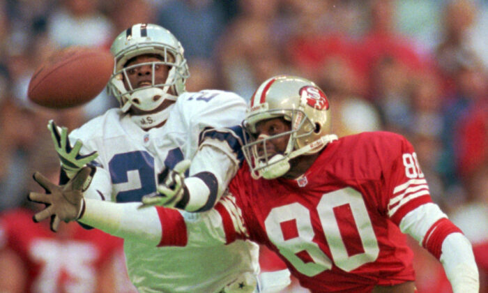 Dallas Cowboys defender Deion Sanders (21) knocks the ball away from San Francisco 49ers receiver Jerry Rice (80), during an NFL game in Irving, Texas, on Nov. 12, 1995. (Eric Gay/AP Photo)