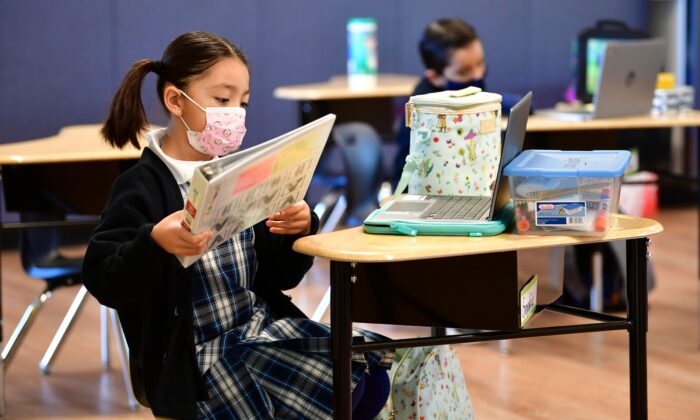 First grade students prepare for class in La Puente, Calif., on Nov. 16, 2020. (FREDERIC J. BROWN/AFP via Getty Images)