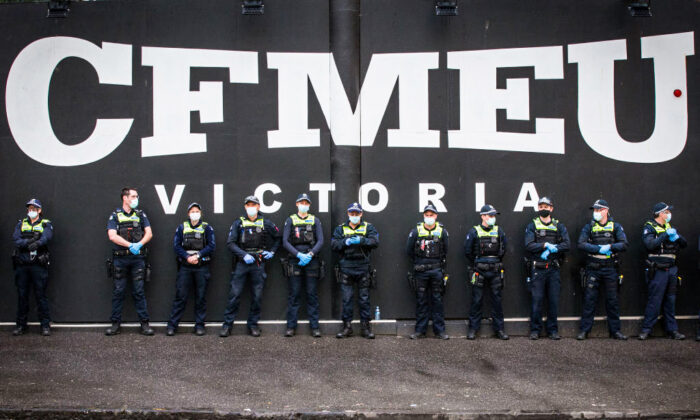 Members of Victoria Police stand outside the CFMEU Office in Melbourne, Australia, on Sept. 21, 2021. (Darrian Traynor/Getty Images)