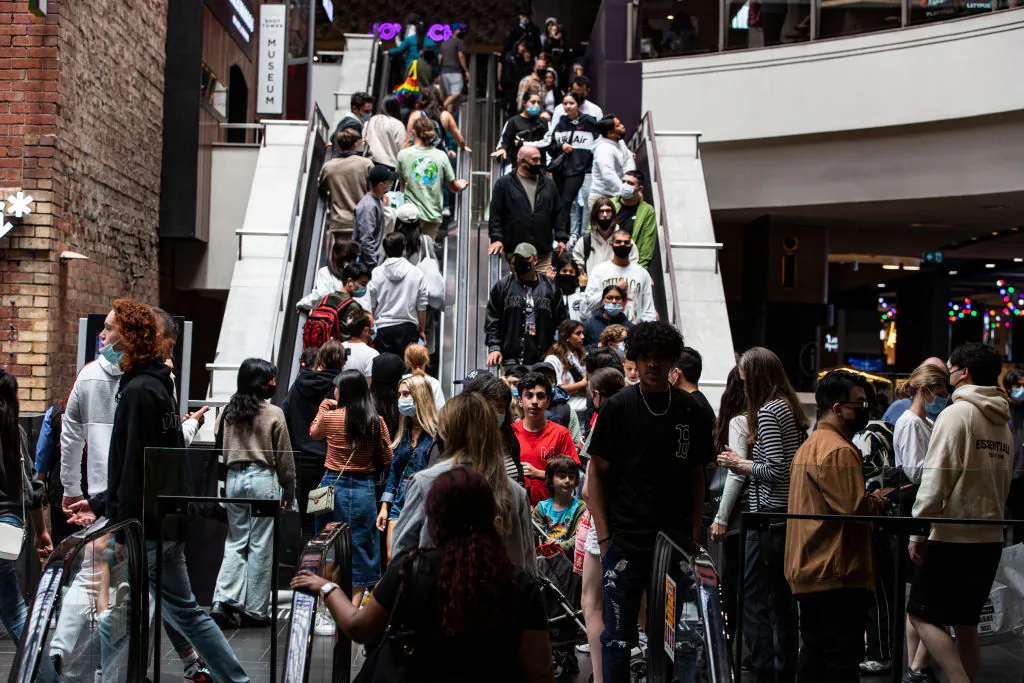 Shoppers ride an escalator at Melbourne Central during the Boxing Day sales in Melbourne, Australia on Dec. 26, 2021. (Diego Fedele/Getty Images)
