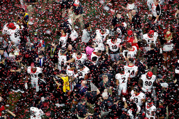 Georgia Bulldogs players celebrate after defeating the Alabama Crimson Tide 33-18 in the 2022 CFP National Championship Game at Lucas Oil Stadium, in Indianapolis, on January 10, 2022. (Dylan Buell/Getty Images)