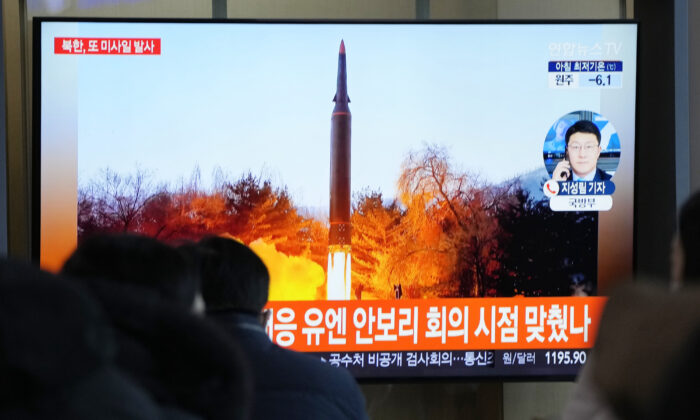 People watch a TV showing a file image of North Korea's missile launch during a news program at the Seoul Railway Station in Seoul, South Korea, on Jan. 11, 2022. (Ahn Young-joon/AP Photo)